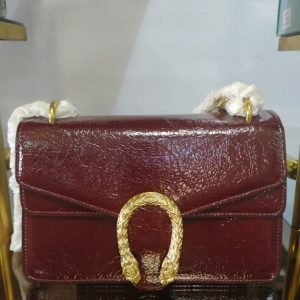 Elegant Maroon Leather Shoulder Bag with Gold Buckle – Luxury Textured Handbag for Women